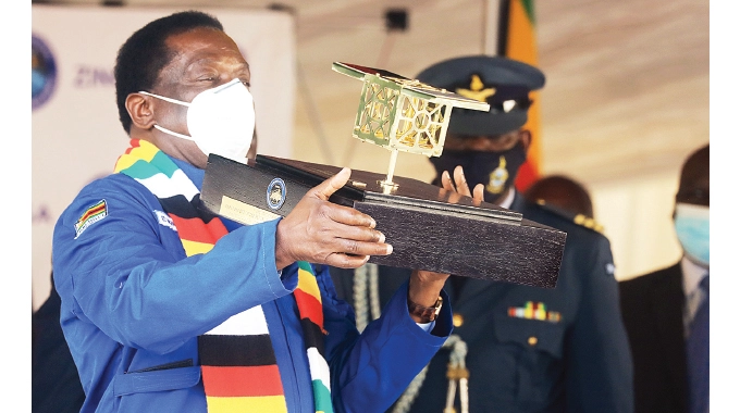 Zimbabwean president with the miniature ZIMSAT-1